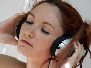 holding-headphones-listening-to-music-3.jpg